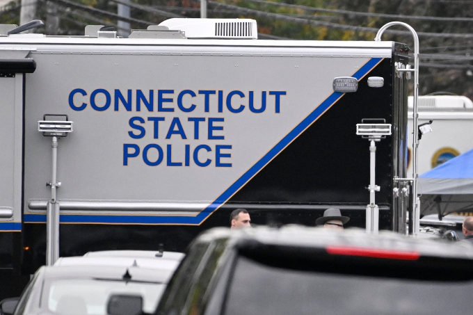 A large vehicle marked with "Connecticut State Police" on the side